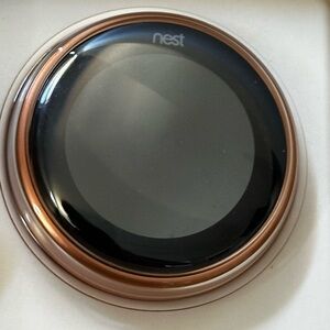 Google Nest Black and Copper Thermostat